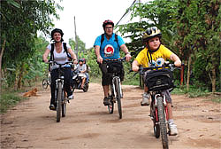 Family cycling in teh mekong Delta